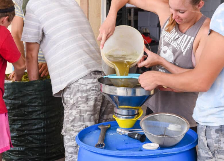 Pouring Roussanne juice into a drum.