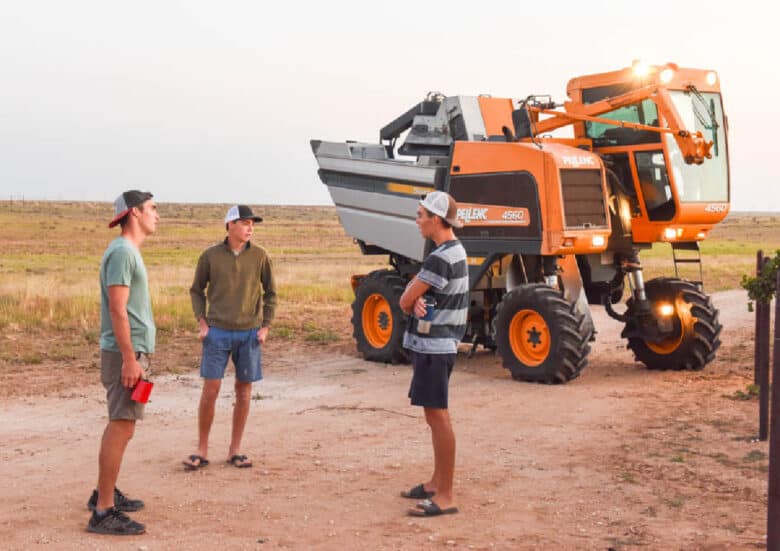 Guys talking in front of the Pellenc.