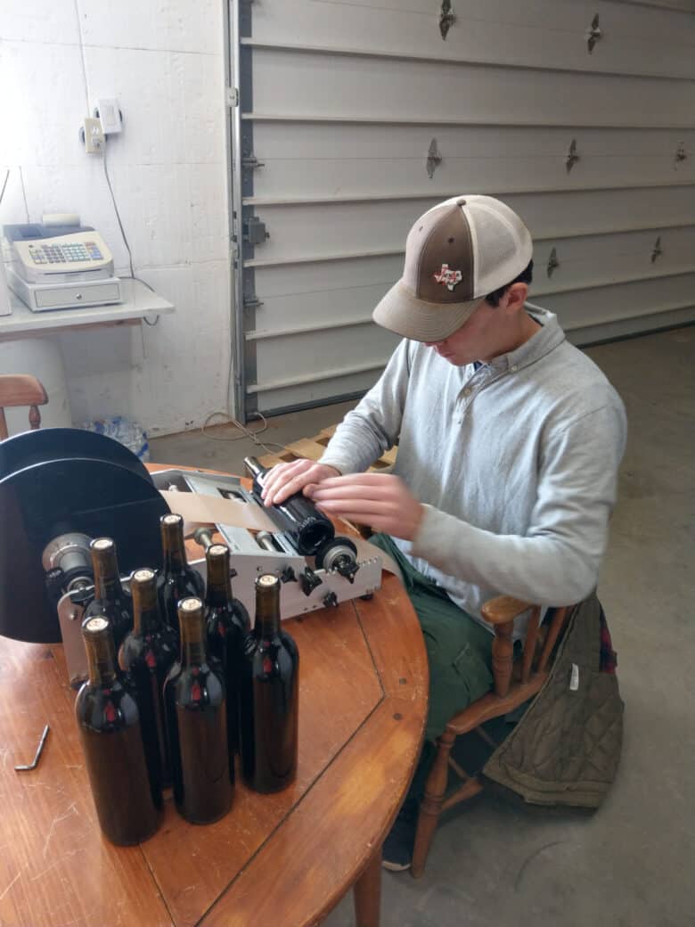 Labeling 2017 Vintage - Christoph putting on the labels.