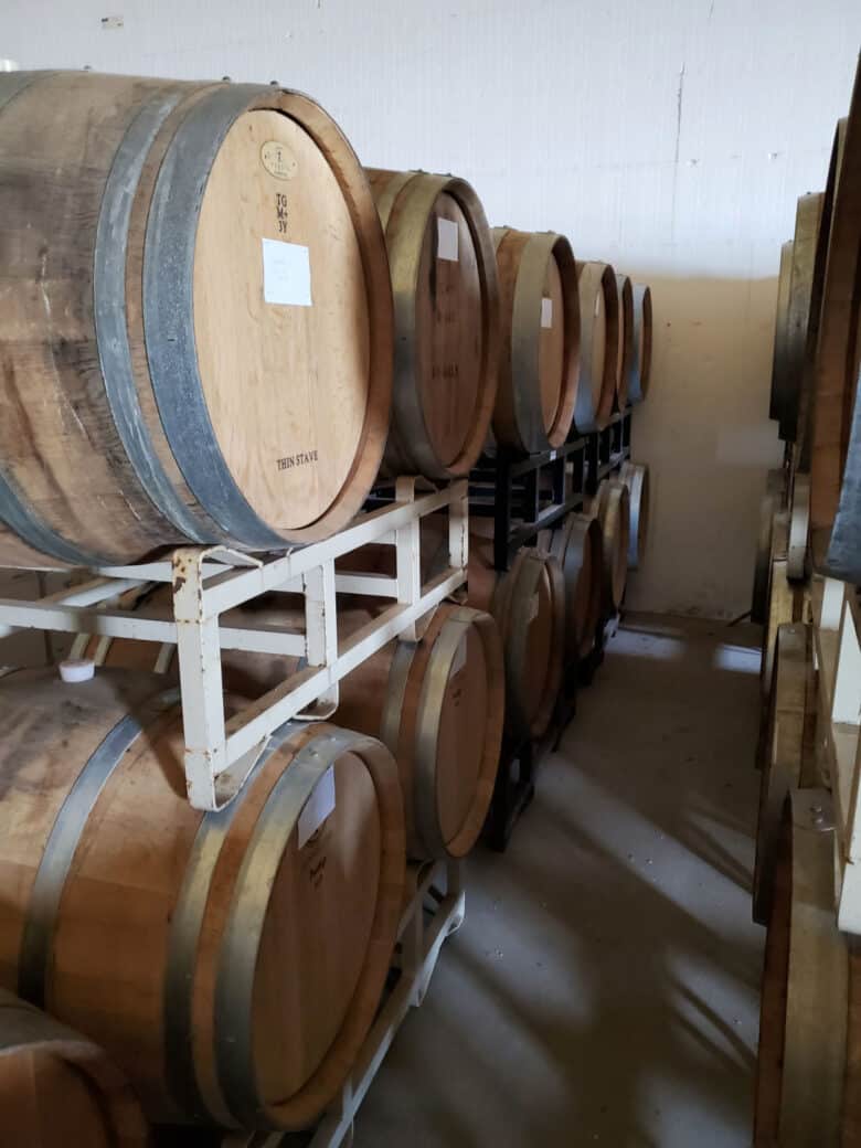 Wine - from Tanks to Barrels - Stacked barrels.