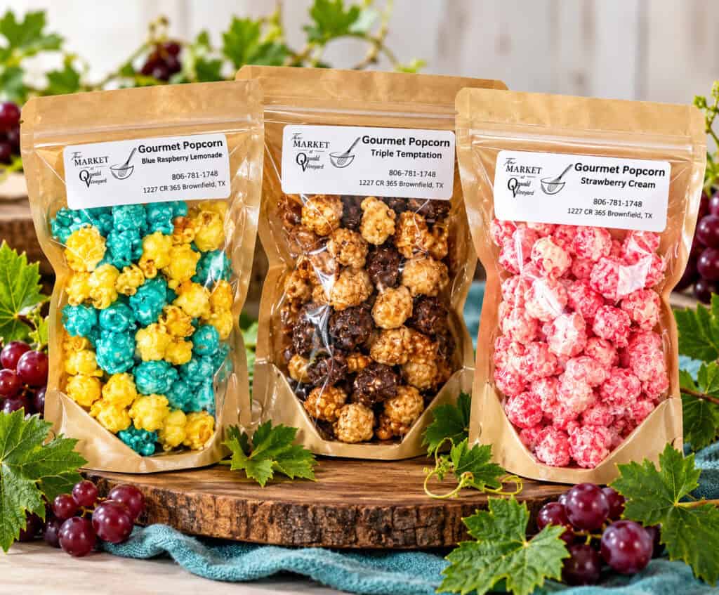 Gourmet Popcorn from The Market at Oswald Vineyard shown in bags on a table.