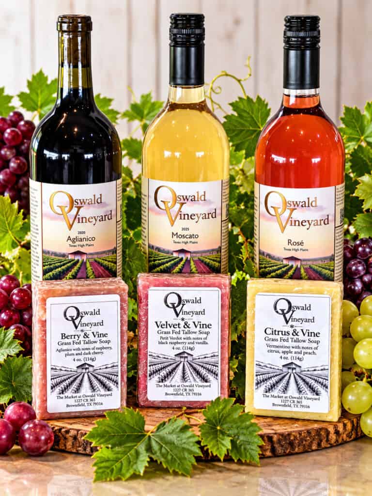Wine-Inspired Grass Fed Tallow Soap shown with Oswald Vindyard Wine on a table.