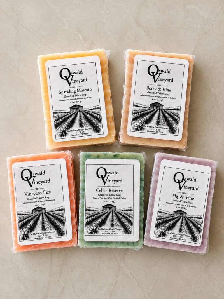 Wine-Inspired Grass Fed Tallow Soap shown in a variety of flavors.